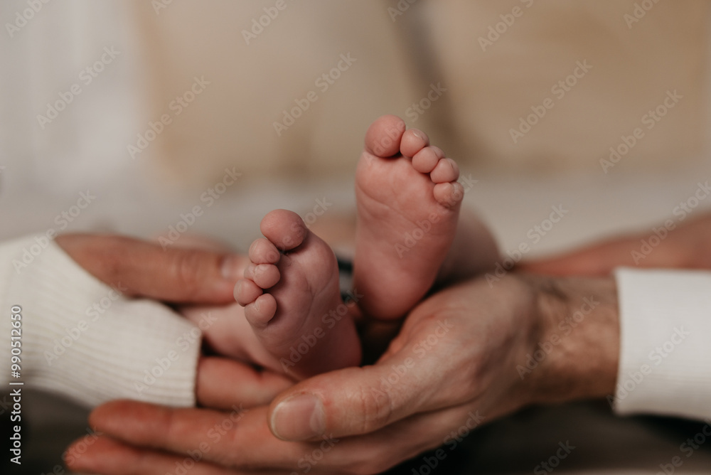 Children's legs in the hands of parents Children's legs in the hands of parents