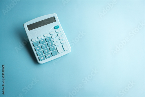 Light blue color calculator, isolated, copy space. Top view.