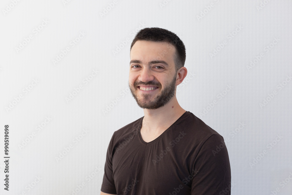 Portrait of an young smiling man on the light gray background with a place for lettering. CV photo Portrait of an young smiling man on the light gray background with a place for lettering. CV photo