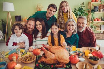 Photo of smiling people thanksgiving day traditional family gathering indoors room home