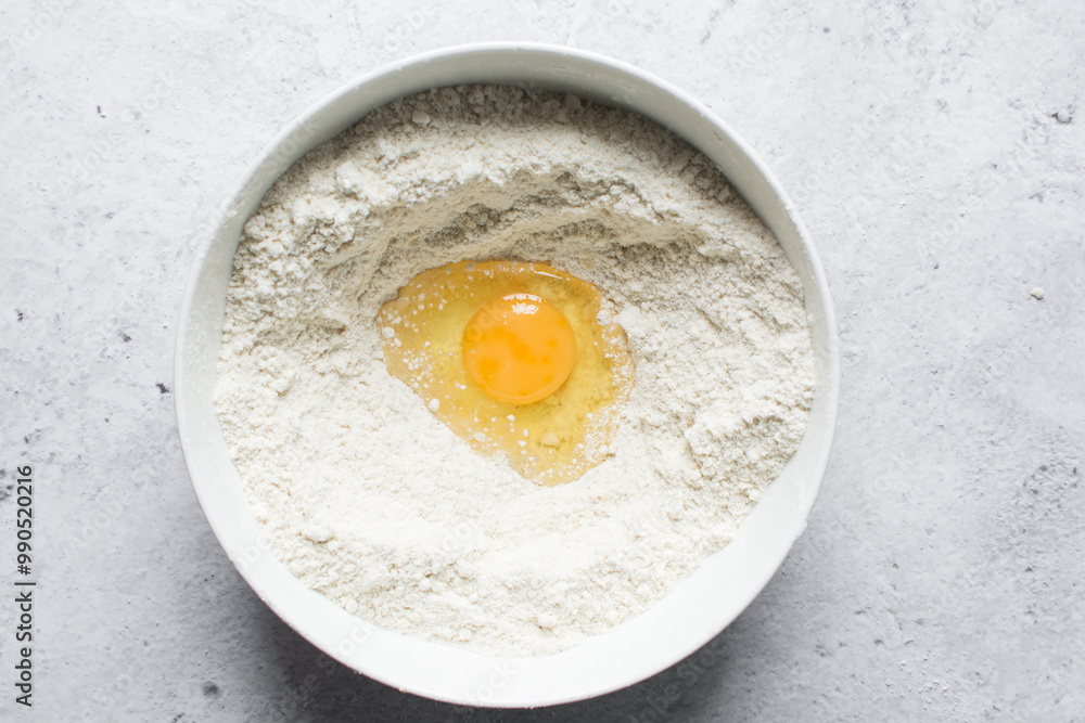 flatlay of ingredients for making nigerian egg roll in a white bowl, process of making egg rolls flatlay of ingredients for making nigerian egg roll in a white bowl, process of making egg rolls