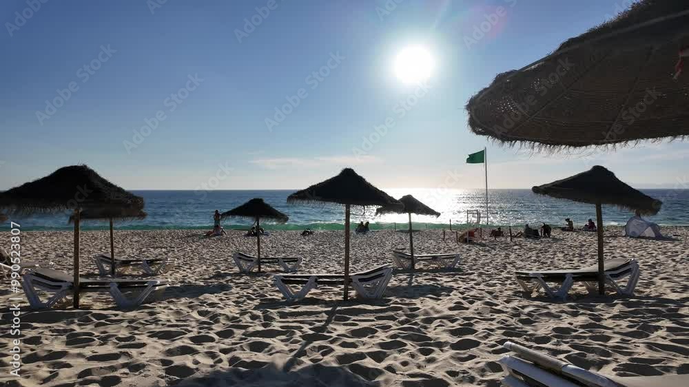 Beautiful beach scene in Comporta, Portugal on a bright summer vacation day, with clear blue skies, soft golden sand, and gentle ocean waves. Beautiful beach scene in Comporta, Portugal on a bright summer vacation day, with clear blue skies, soft golden sand, and gentle ocean waves.