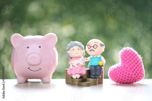 Love couple senior and piggy bank on natural green background, Save money for prepare in future and pension retirement concept