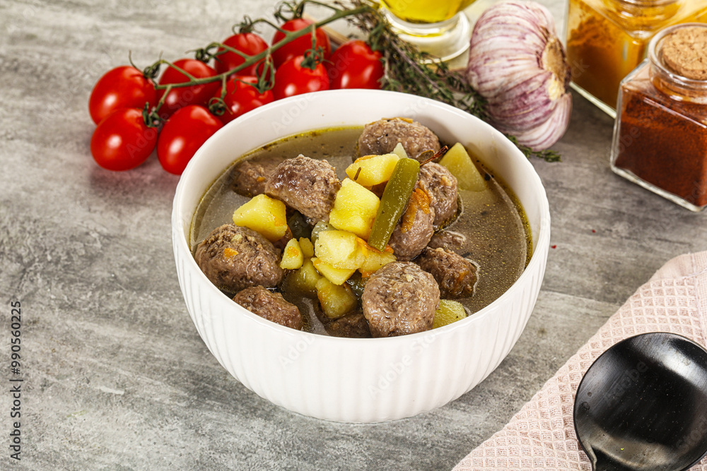 Soup with meatball and potato
