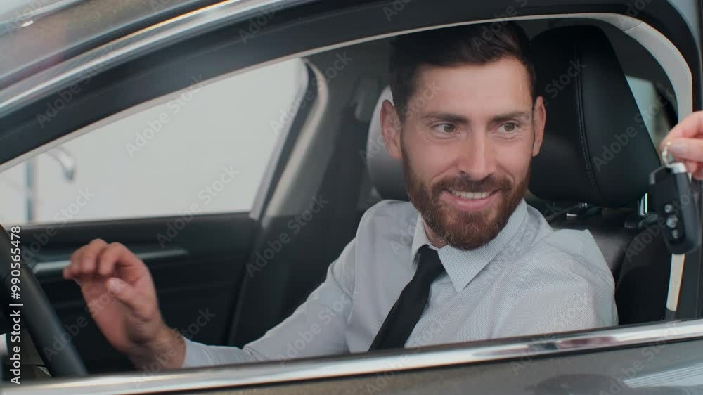 Sales manager handing over the keys to man that sitting in the car. Sales manager handing over the keys to man that sitting in the car.