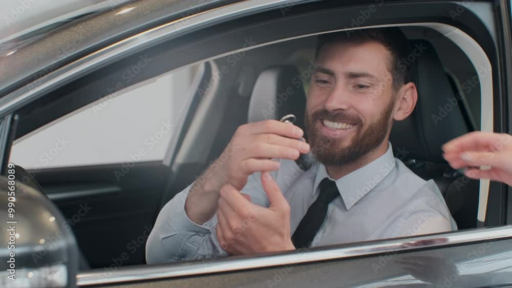 Sales manager handing over the keys to man that sitting in the car. Sales manager handing over the keys to man that sitting in the car.