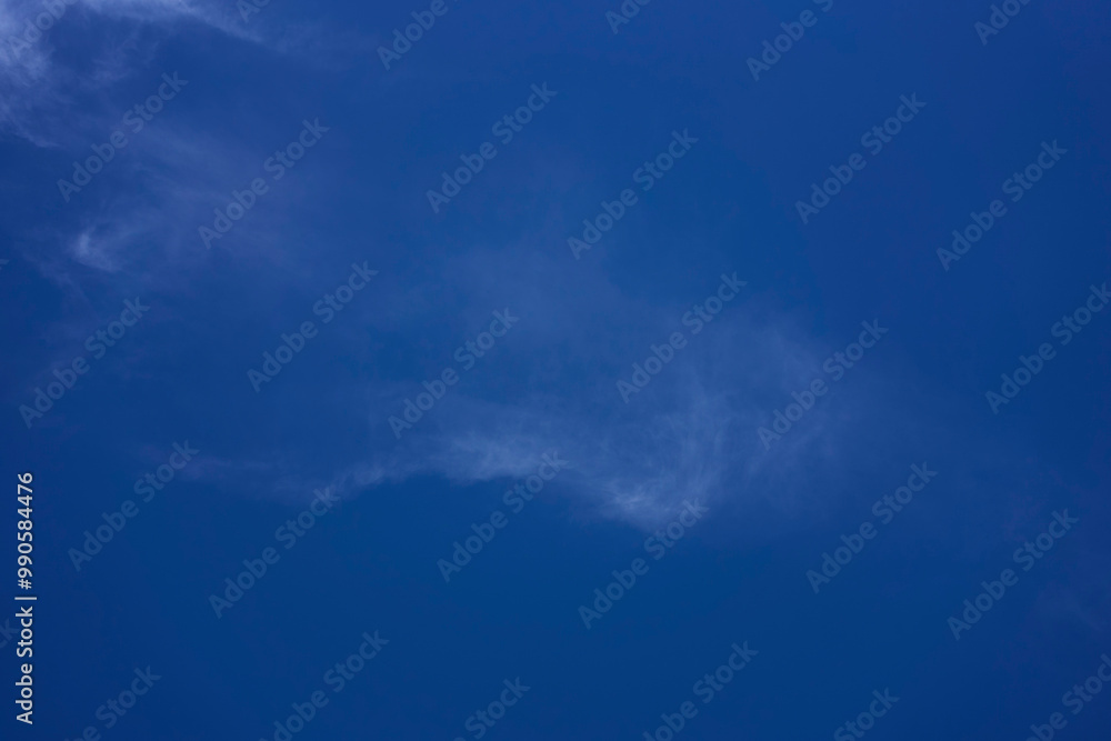 the sky on a summer day with white cirrus clouds the sky on a summer day with white cirrus clouds