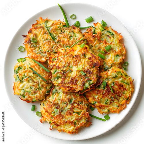 Crispy vegetable pancakes garnished with scallions isolated on white background