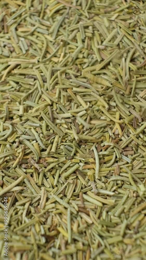 Spice rosemary pours macro vertical slow motion Spice rosemary pours macro vertical slow motion