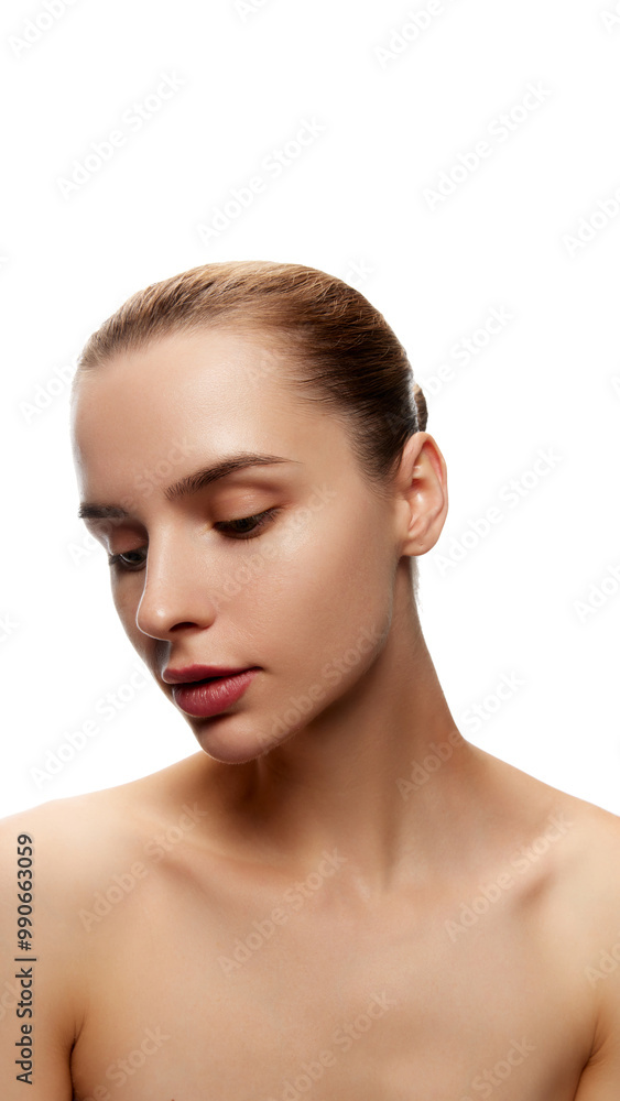 Portrait of beautiful young woman with smooth spotless skin, bare shoulders, posing in ponytail isolated on white background. Hair mask. Natural female beauty, skin care, cosmetics and cosmetology Portrait of beautiful young woman with smooth spotless skin, bare shoulders, posing in ponytail isolated on white background. Hair mask. Natural female beauty, skin care, cosmetics and cosmetology