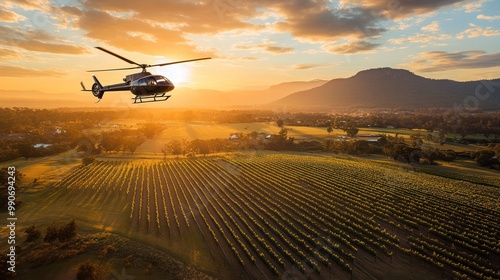 Helicopter over lush vineyard landscape at sunrise. photo