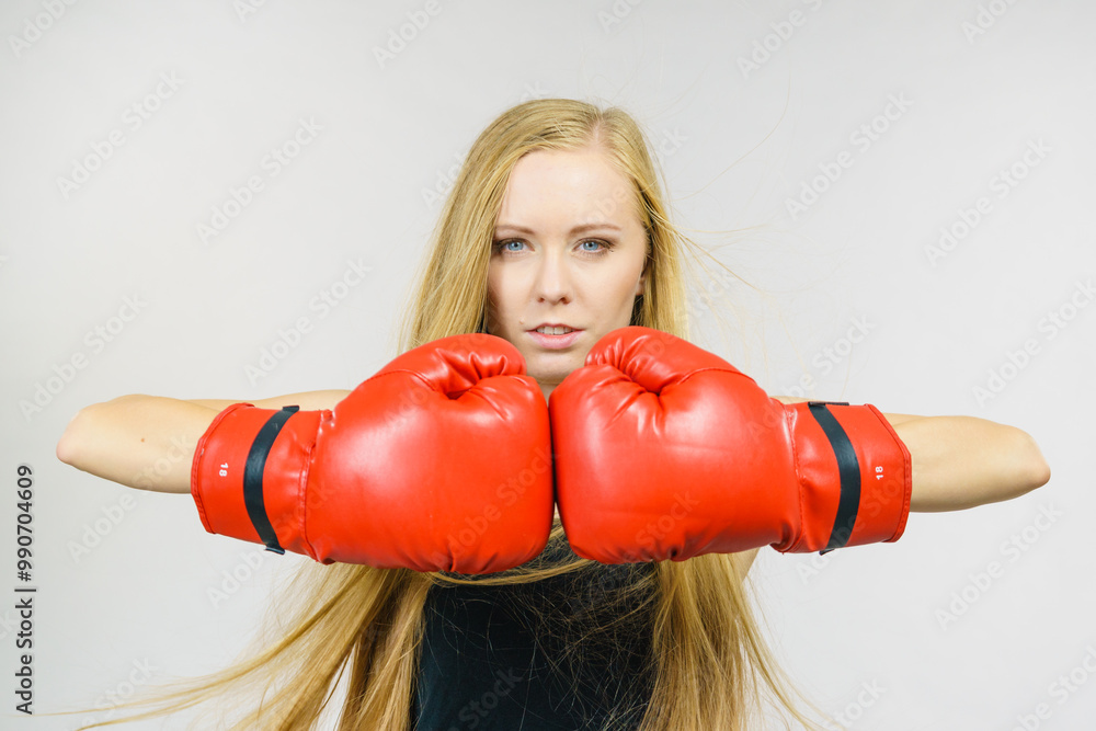 Woman in gloves playing sports boxing Woman in gloves playing sports boxing