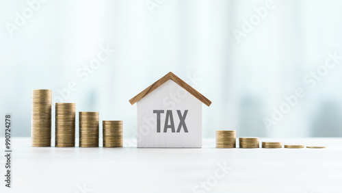 Wallpaper Mural House model and stack of coins on a table against a bright white background, symbolizing the concept of real estate taxes, financial planning, and property investment Torontodigital.ca