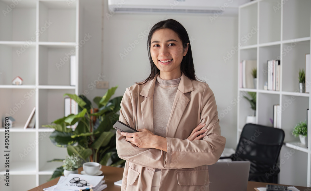 Confident Young Business Woman in Modern Office Setting with Arms Crossed and Smiling Confident Young Business Woman in Modern Office Setting with Arms Crossed and Smiling