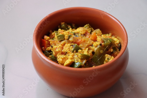 Paneer Bhurji or paneer burji, cottage cheesse fry with onion, tomato, capsicum and spices photo