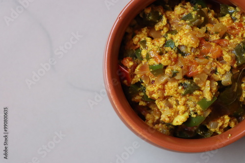 Paneer Bhurji or paneer burji, cottage cheesse fry with onion, tomato, capsicum and spices photo