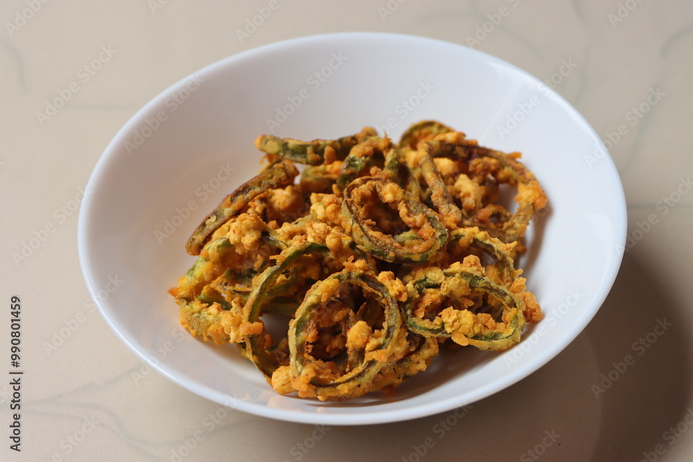 Marcha na ring bhajiya, Gujrati snack, ring fritters made with chili peppers Marcha na ring bhajiya, Gujrati snack, ring fritters made with chili peppers