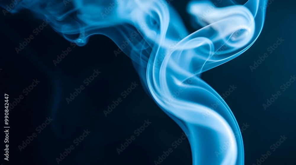 Fototapeta premium Captivating image capturing the wispy swirling patterns of cigarette smoke rising against a dark background illuminated by a soft ambient glow that creates a moody
