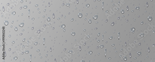 Rain transparent drops flow down the glass.Realistic wet condensation texture.Fresh water splash effect on the surface.Liquid spreading droplet shapes.
