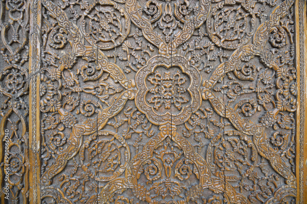 Old wooden carved door, Samarkand, Uzbekistan. Old wooden carved door, Samarkand, Uzbekistan.