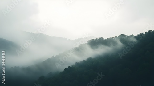 A tranquil mountain landscape shrouded in early morning fog creating an ethereal and mystical atmosphere that captivates the senses and inspires a sense of wonder and solitude