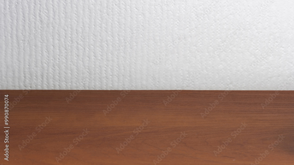 Empty Brown Wooden Table for Product Display Against White Wallpaper Background Empty Brown Wooden Table for Product Display Against White Wallpaper Background