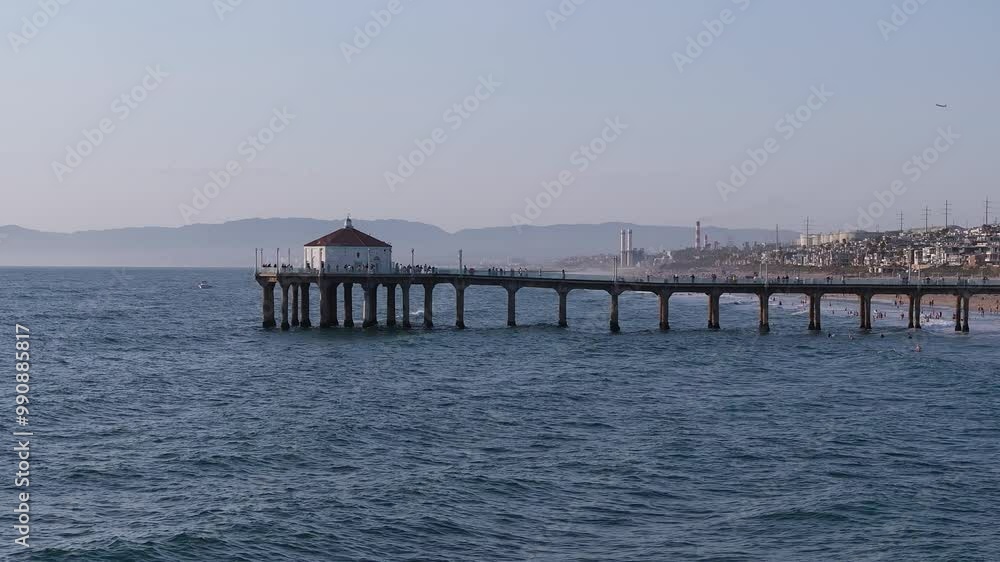 Aerial View over Manhattan Beach in California with Green Blue Water and Blue Sky. Beautiful Manhattan Beach pier in California USA Aerial View over Manhattan Beach in California with Green Blue Water and Blue Sky. Beautiful Manhattan Beach pier in California USA