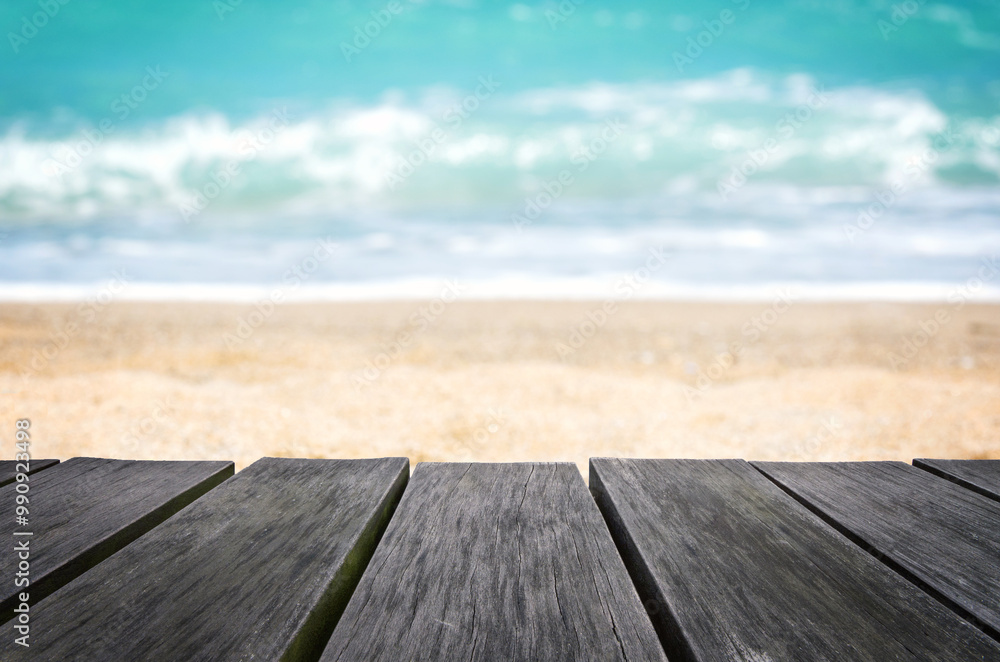 Empty wooden table with blurred beach background