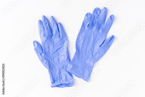 Obraz na płótnie Blue nitrile gloves on white background. Top view w salonie