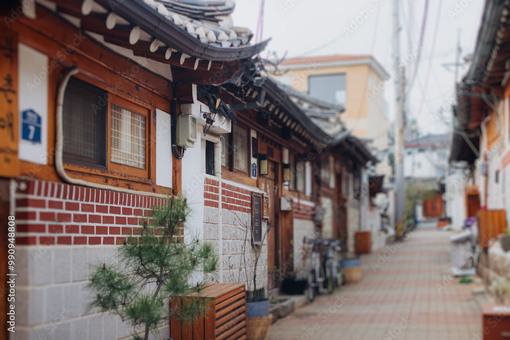 Fototapeta premium Bukchon Hanok Village, Jongno District, Seoul, South Korea, streets with traditional korean houses, travel to South Korea concept in a spring sunny day