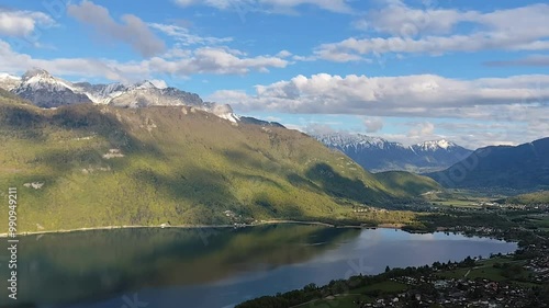 alpine landscape at the end of annecy lake, on top of taillefer with view on verthier and doussard and mountains in spring, panorama hd video photo