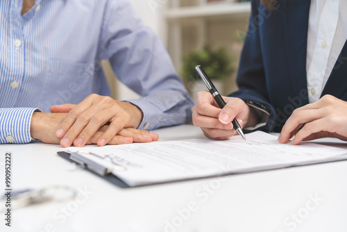 Photography Financial, asian woman lease landlord, agent banker or bonding hand is pointing to contract of tenant, new owner or renter of home to sign signature on purchase, rental property