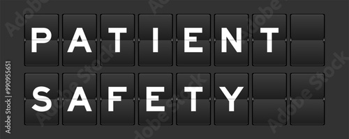 Black color analog flip board with word patient safety on gray background