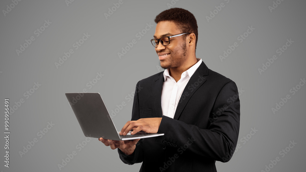 Searching Information. Happy black businessman using laptop, choosing hotel room online, booking tickets, copyspace Searching Information. Happy black businessman using laptop, choosing hotel room online, booking tickets, copyspace