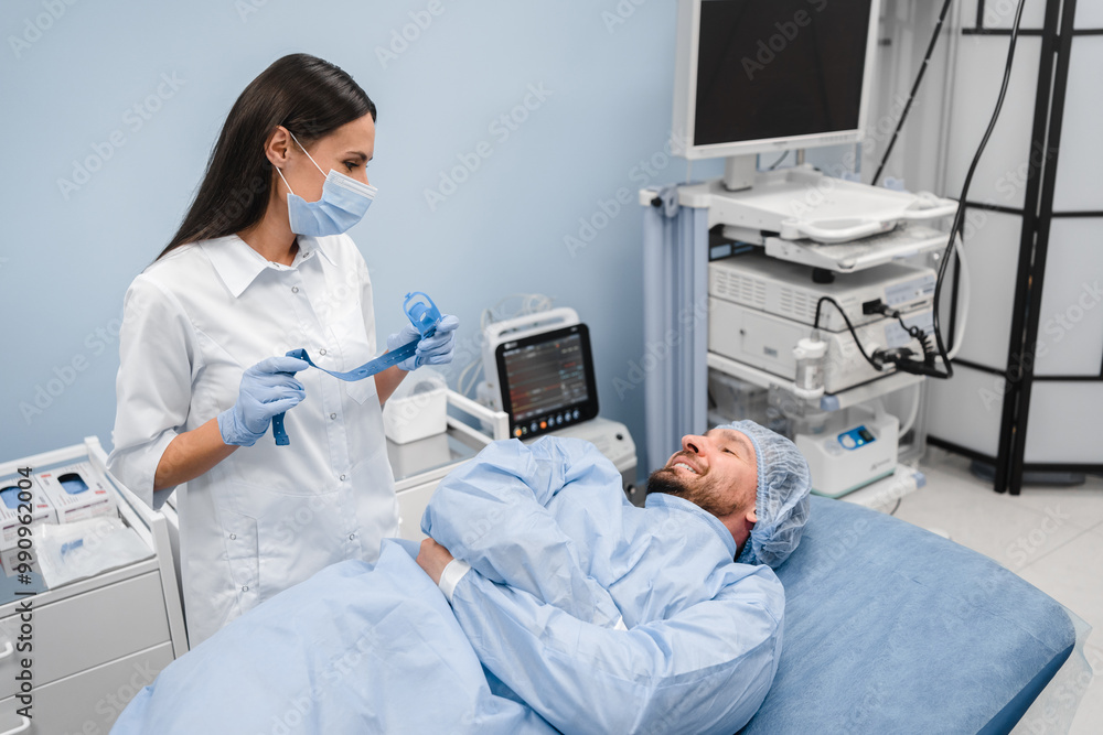 Obraz premium Endoscopy at the hospital. Doctor gastroenterologist holding endoscope before gastroscopy in a modern medical private clinic cabinet hospital . Medical examination