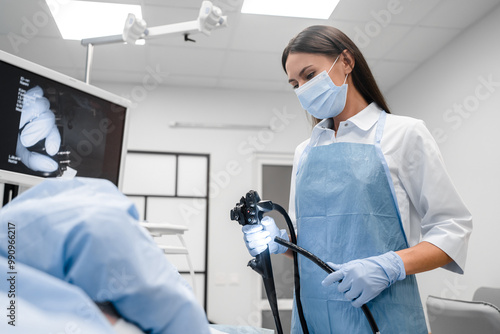 Konstfotografi Female doctor holding modern endoscope device before gastroscopy examination