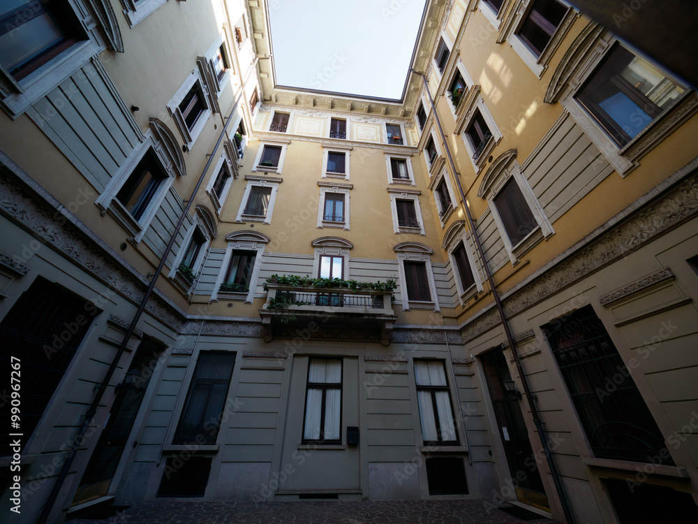 Obraz premium Old residential building along via Biondi in Milan, Italy