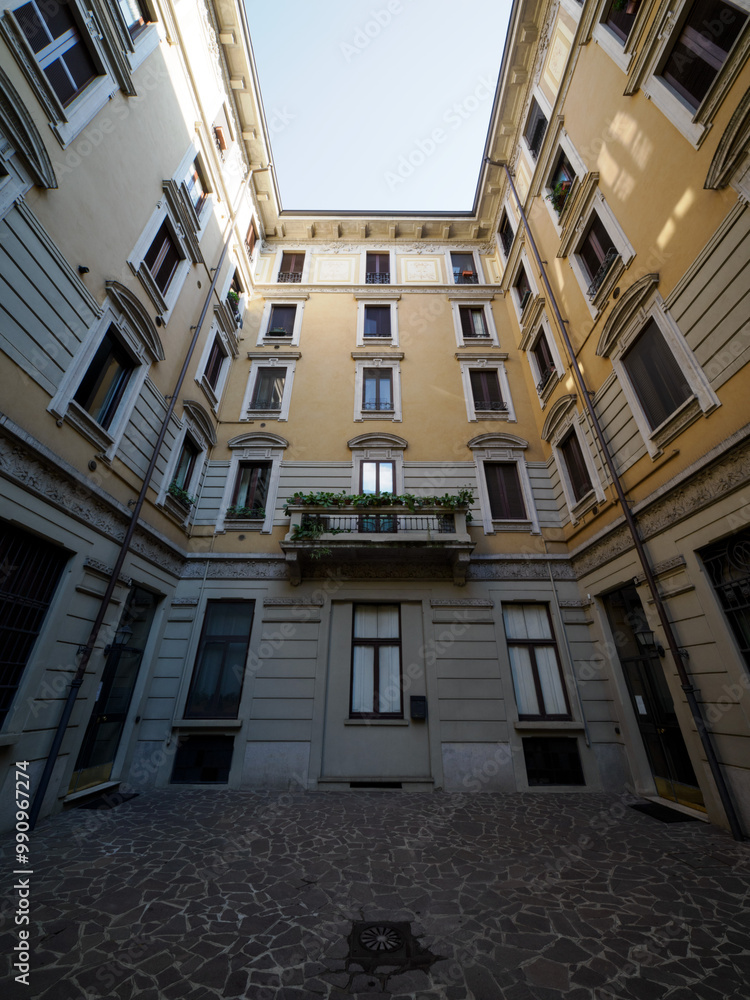 Fototapeta premium Old residential building along via Biondi in Milan, Italy
