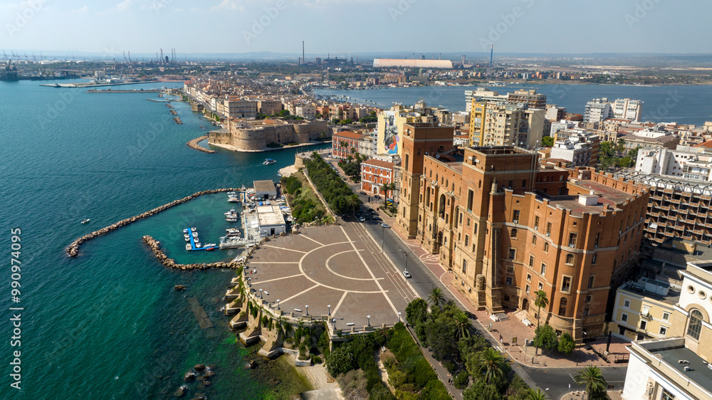 Obraz premium Aerial view of the Government Palace in Taranto, Puglia, Italy. It is the seat of the Prefecture and the provincial administration. The building overlooks the seafront and Marinai d'Italia roundabout.