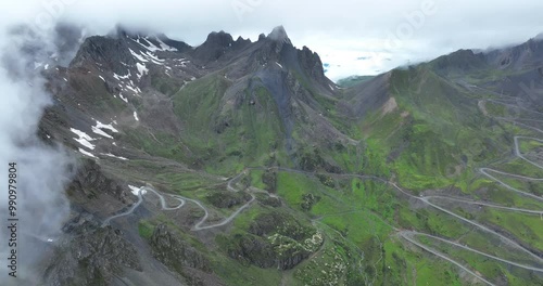 Aerial footage of beautiful high altitude snow capped mountain landscape