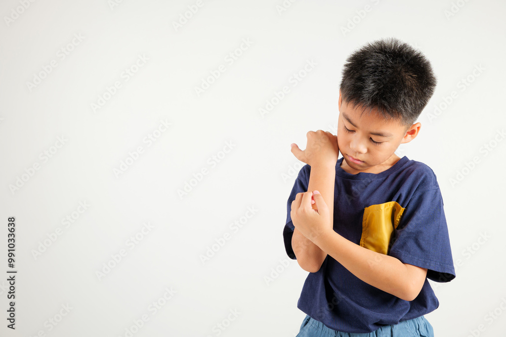 Asian little kid boy scratching itchy arm from a mosquito bite at studio shot isolated on white background, Portrait of Thai primary child dermatitis and scabies, Allergy symptoms, Malaria day concept Asian little kid boy scratching itchy arm from a mosquito bite at studio shot isolated on white background, Portrait of Thai primary child dermatitis and scabies, Allergy symptoms, Malaria day concept