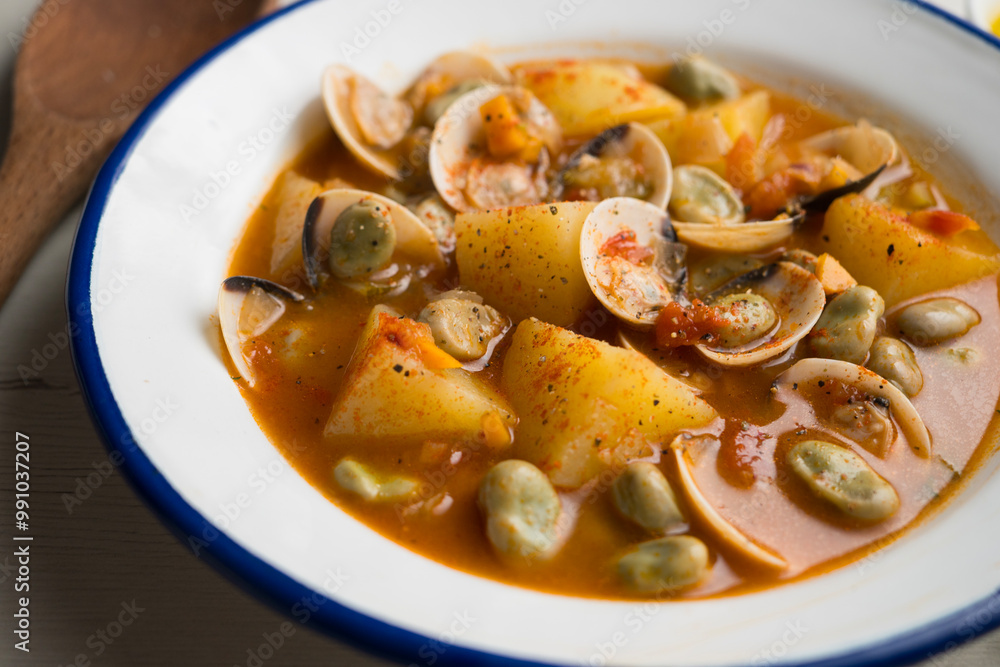 Fish stew with clams, potatoes and green beans. Traditional Spanish recipe. Fish stew with clams, potatoes and green beans. Traditional Spanish recipe.