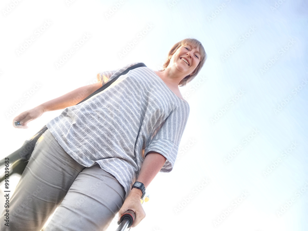 A traveling blogger smiles for a selfie near the waterfront, showcasing her adventure on a sunny afternoon A traveling blogger smiles for a selfie near the waterfront, showcasing her adventure on a sunny afternoon