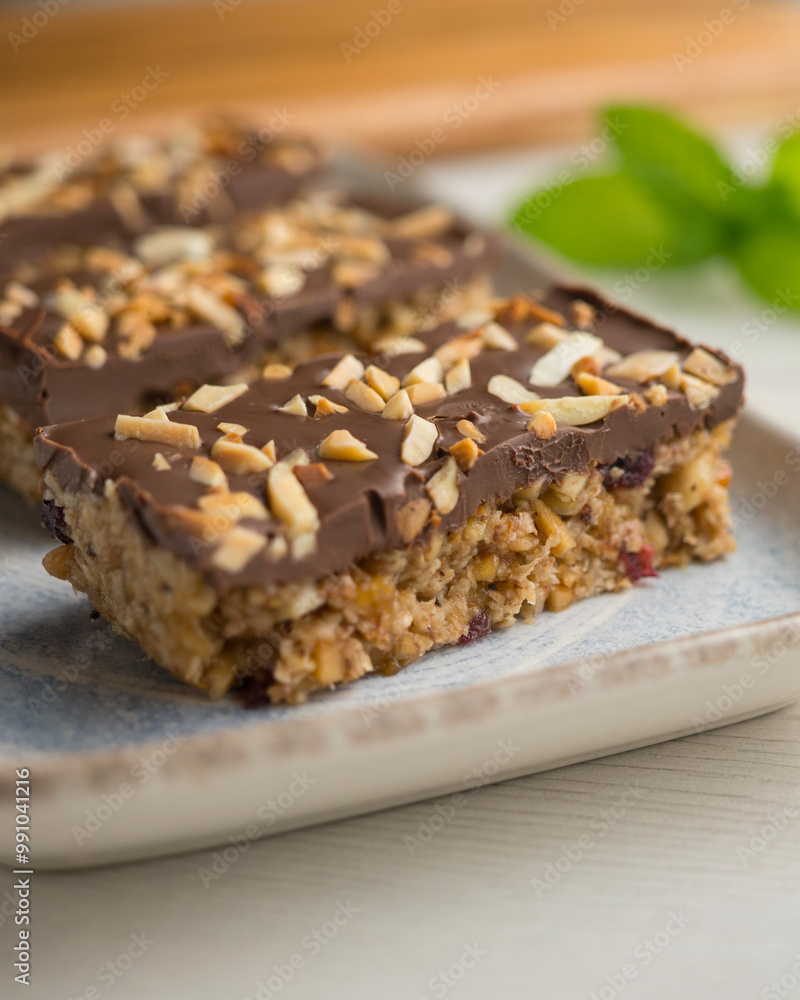 Homemade energy bars made with oats, nuts and chocolate. Homemade energy bars made with oats, nuts and chocolate.