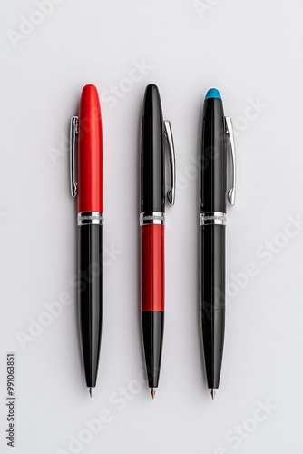 Symmetrical Trio of Executive Pens on White Black Barrels, Red and Blue Caps - Minimalist Business Tool Collection for Branding and Promotions