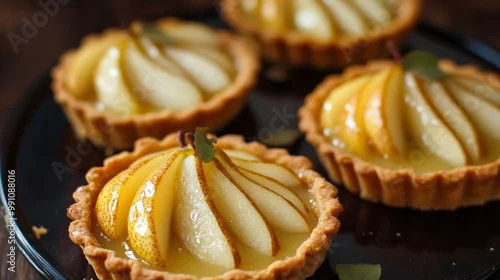 Obraz  z motywem Elegant Pear Tarts in Soft Light, Exquisite Culinary Presentation for Gourmet Desserts