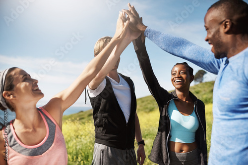 People, high five and together for teamwork on mountain or hill with diversity, support and exercise. Group, freedom and happiness for workout, running club and sport in outdoor adventure or training photo