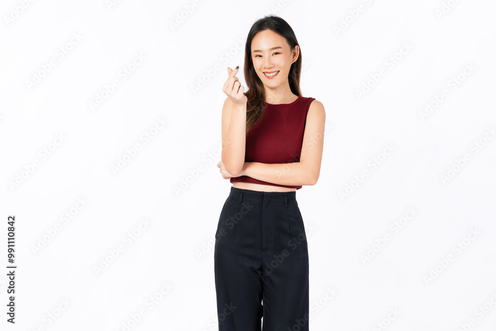 Cheerful beautiful Asian woman showing mini heart sign on white background, love concept. Cheerful beautiful Asian woman showing mini heart sign on white background, love concept.