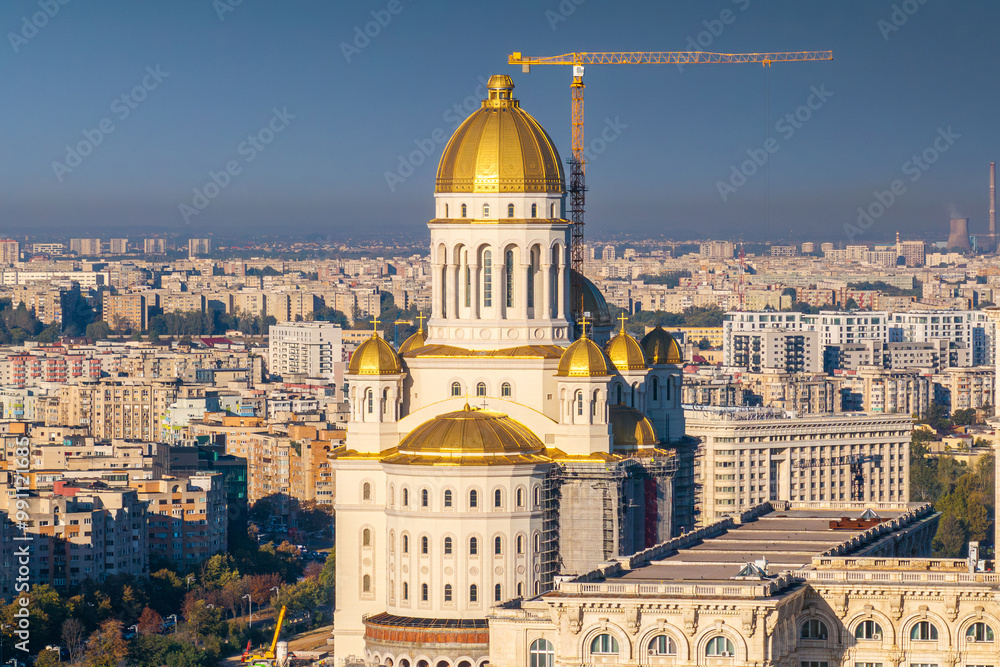 National Cathedral. Aerial view with the national orthodox cathedral (Catedrala Manturii Neamului in Romanian) with Palace of the Parliament in foreground. Landmarks of Bucharest.