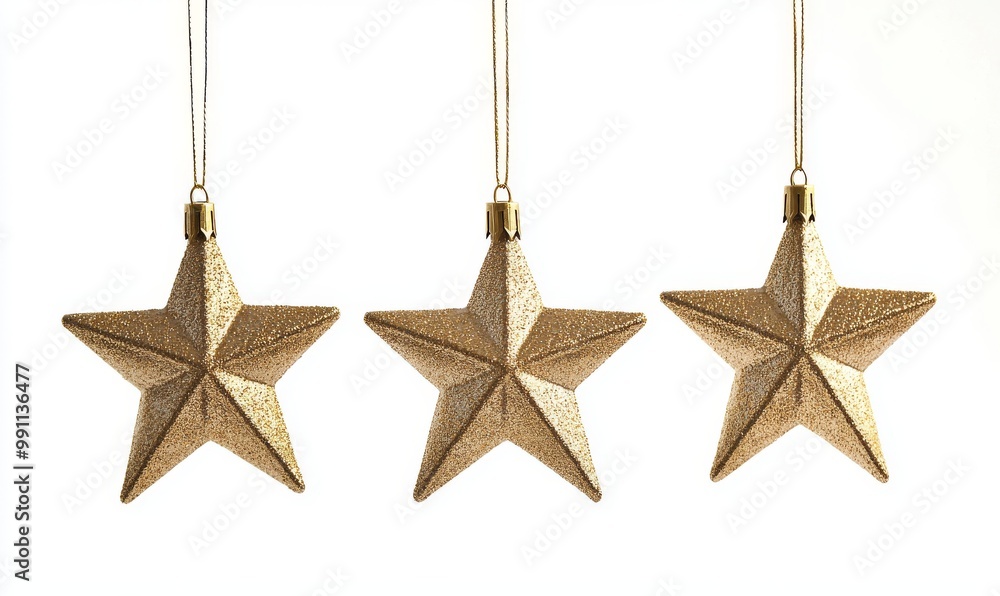 There are six golden stars hanging isolated on a Christmas tree There are six golden stars hanging isolated on a Christmas tree